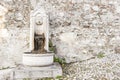 Small ancient fountain, of stone. Royalty Free Stock Photo