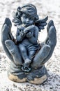 Small Angel sitting In Hands Holding Bird Royalty Free Stock Photo