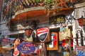 Small antique shop with a wooden balcony and an old lantern above the entrance, Malcesine, Italy Royalty Free Stock Photo