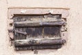 Small antique wooden door with an iron rusty latch, closeup Royalty Free Stock Photo