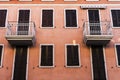 Small apartment rooms with identical balconies