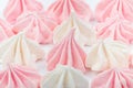 Small appetizing white and pink marshmallows shot on macro with selected focus on a white background in studio Royalty Free Stock Photo