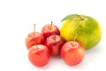 Small apples and a big orange Royalty Free Stock Photo