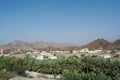 Small arabian town located among montains and palm trees forest