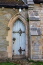 Small ornate arched church door Royalty Free Stock Photo