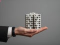 Small architectural model held in businessman hand Royalty Free Stock Photo