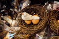 The small artificial bird nest with fake eggs in it Royalty Free Stock Photo