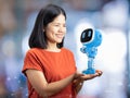 Small artificial intelligence robot assistant in human hand Royalty Free Stock Photo