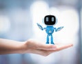 Small artificial intelligence robot assistant in human hand Royalty Free Stock Photo