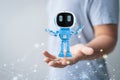 Small artificial intelligence robot assistant in human hand Royalty Free Stock Photo