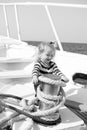 Small baby boy with happy face on boat with rope Royalty Free Stock Photo