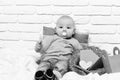 Small baby boy kid on white brick wall background Royalty Free Stock Photo