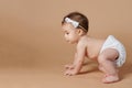 Small baby crawl on brown background Royalty Free Stock Photo