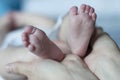 Small baby feeet with hands to her parent Royalty Free Stock Photo