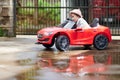 Small baby girl driving toy car Royalty Free Stock Photo