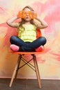 Small baby girl in orange sunglasses and yellow shirt Royalty Free Stock Photo