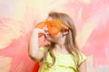 Small baby girl in orange sunglasses and yellow shirt Royalty Free Stock Photo