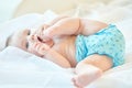 Small baby playing with his leg Royalty Free Stock Photo