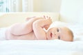 Small baby playing with his legs Royalty Free Stock Photo