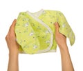 Small baby's undershirt in the female hands