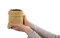 Small bag of coffee beans in female hands Royalty Free Stock Photo