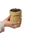 Small bag of coffee beans in female hands