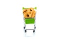 Small bagels in a metal shopping trolley isolated on white.