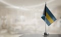 A small Bahamas flag on an abstract blurry background