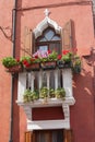 Small Balcony with flower pots on the island of Burano, Venice Royalty Free Stock Photo