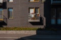 Small balcony, gray brick wall window Royalty Free Stock Photo