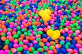 Small ball and yellow rubber duck in the water for playing games. Royalty Free Stock Photo