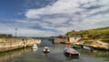 Small Ballintoy Harbour with stone pier and moored boats, Northern Ireland Royalty Free Stock Photo