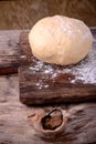 Small balls of fresh homemade dough on floured