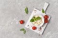 Small balls mozzarella cheese with Cherry tomatoes and basil Royalty Free Stock Photo