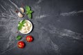 Small balls mozzarella cheese with Cherry tomatoes, garlic and basil Royalty Free Stock Photo