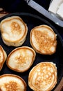 Small banana pancakes on a frying pan