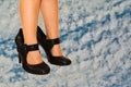 Small bare feet in big shoes Royalty Free Stock Photo