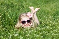 Small barefooted girl in grass