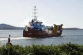 Small barge motoring out of Gladstone harbour.