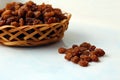 Small basket of dried grape brown raisins