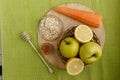 Small basket with fruits. Apples, lemons, carrot on the table. Royalty Free Stock Photo