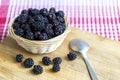 Small basket full of ripe blackberries Royalty Free Stock Photo