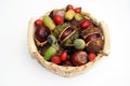 Small basket with horse chestnuts, acorns and rose hips Royalty Free Stock Photo