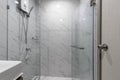 Small Bathroom in Apartment with Water Heater and Shower Cabin