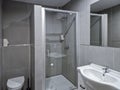 A small bathroom with a shower and a toilet. Royalty Free Stock Photo