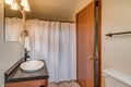 Small bathroom vanity and shower curtain real estate Royalty Free Stock Photo