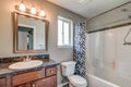 Small bathroom wood vanity toilet sink mirror shower real estate