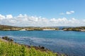 Small bay with rocks on the shoreline, sunny spring day