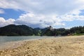 Small beach at the Lake Czorsztyn. Medieval castle in Niedzica in the distance. Poland