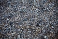 Small beach light pebble rocks floor. Different stones background texture in nature. Outdoors. Grid gravel with several shapes. Na Royalty Free Stock Photo